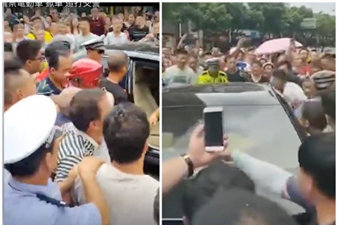 湖南省邵陽市の市民は8月7日、市政府庁舎の前で、電動バイクの取り締まり措置に抗議した。大勢の市民が市幹部の乗っている公用車を取り囲んだ（スクリーンショット）
